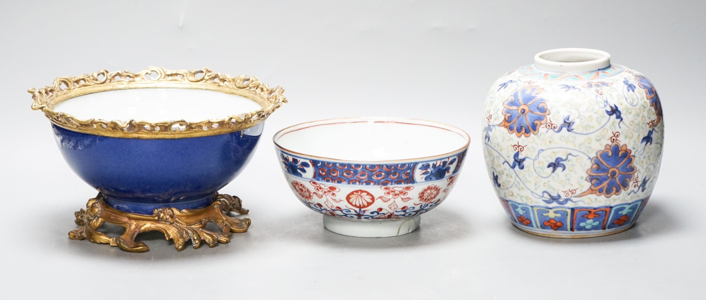 An 18th century Chinese clobbered blue and white bowl, a Samson powder blue ormolu mounted bowl, 19.5cm wide and a 19th century Chinese doucai style jar